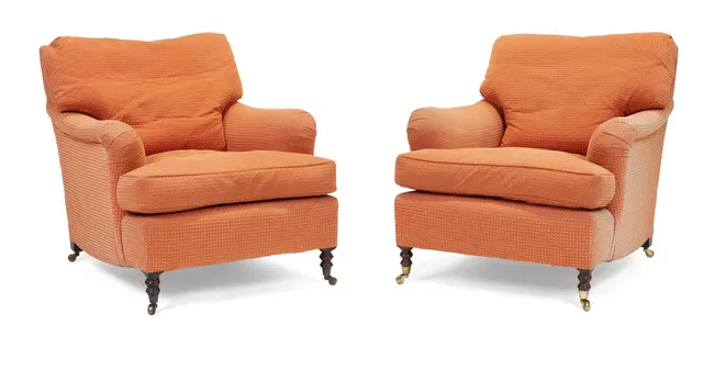 A pair of modern easy armchairs