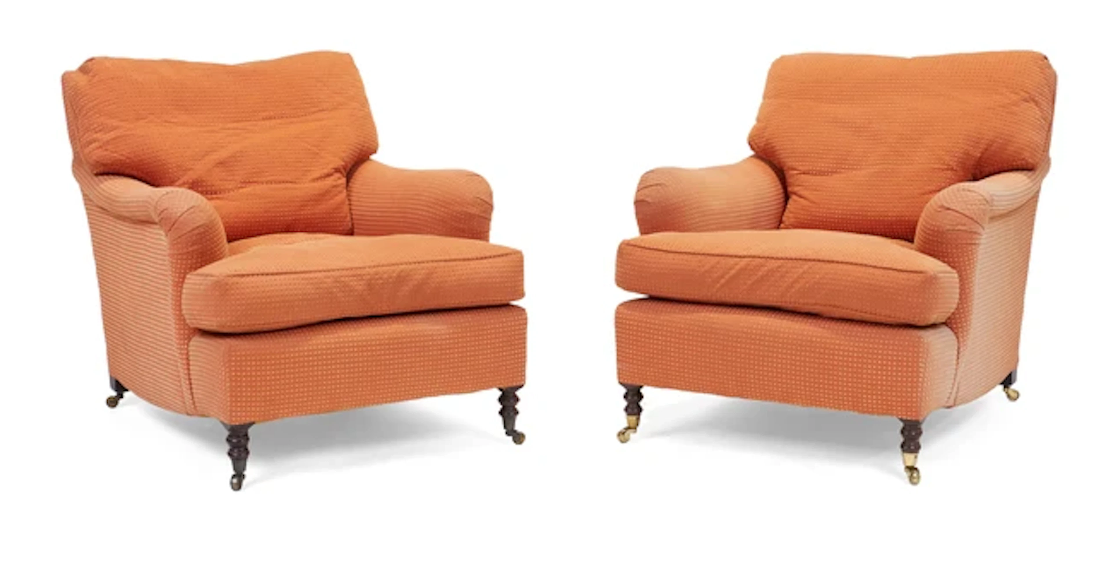 A pair of modern easy armchairs