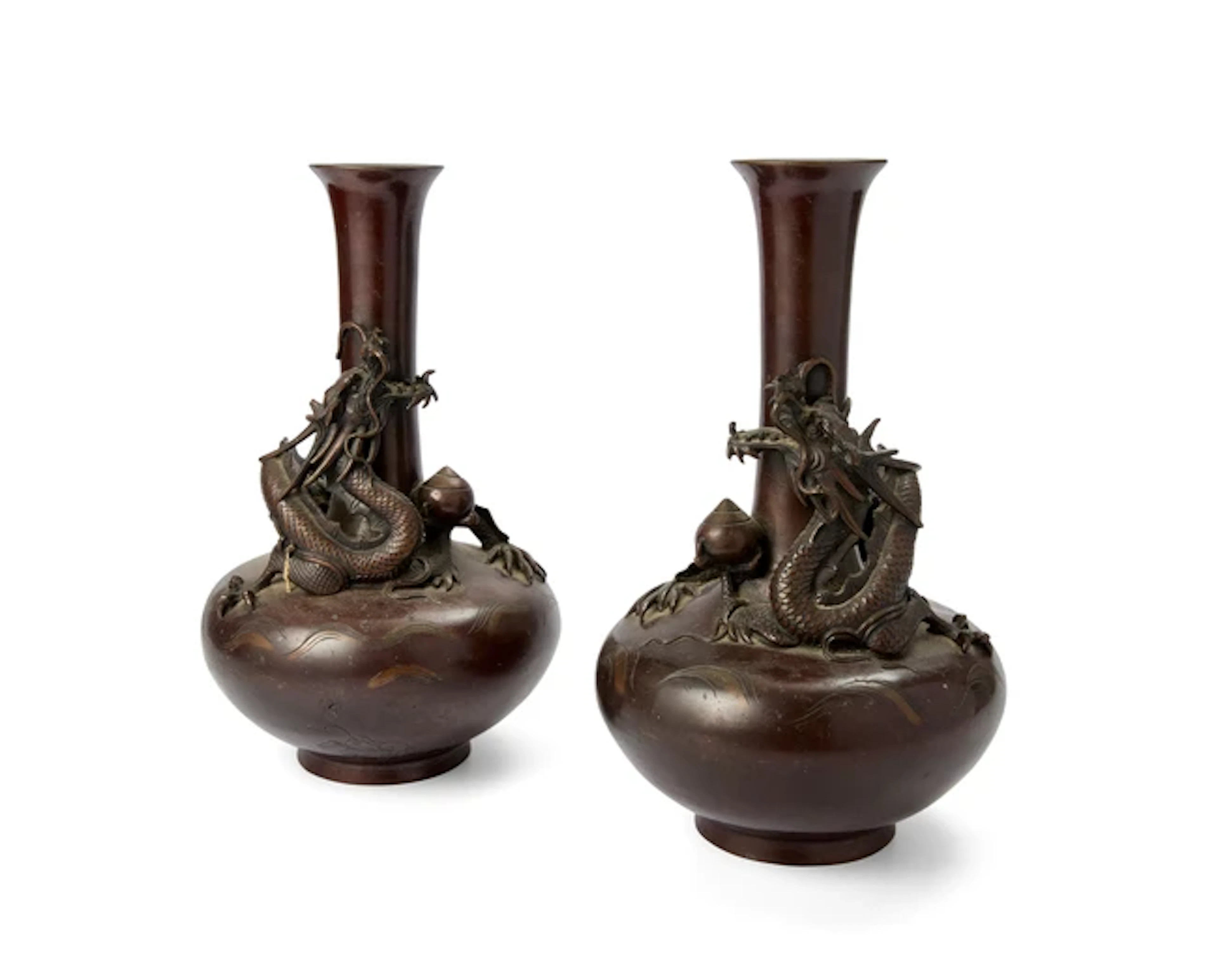 A pair of Japanese bronze dragon vases by Yoshida Meiji...