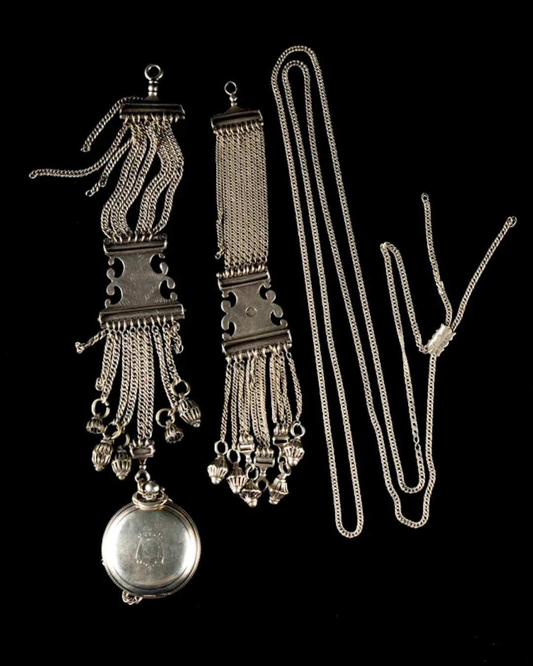 A silver cased pocket watch and attachment chain