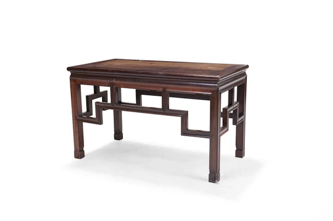 A Chinese hongmu low side table 20th century Carved with...