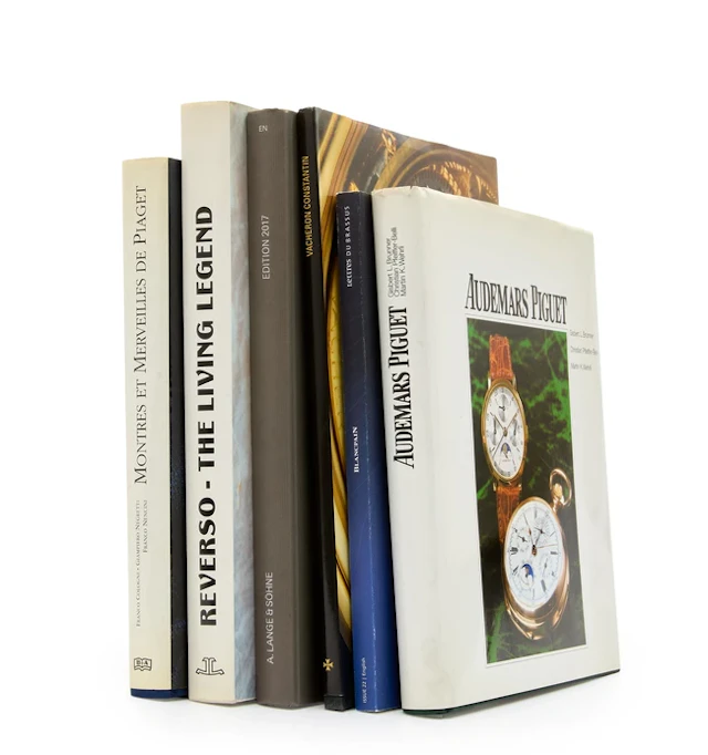 A group of watch books