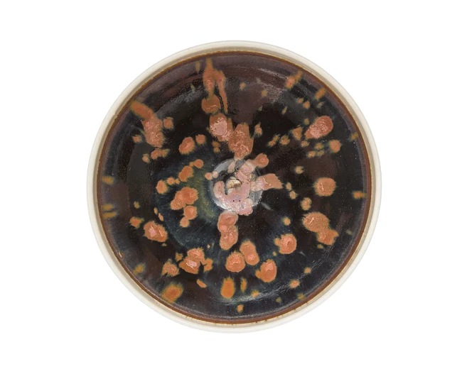 A Chinese Henan black-glazed russet-splashed conical bowl...