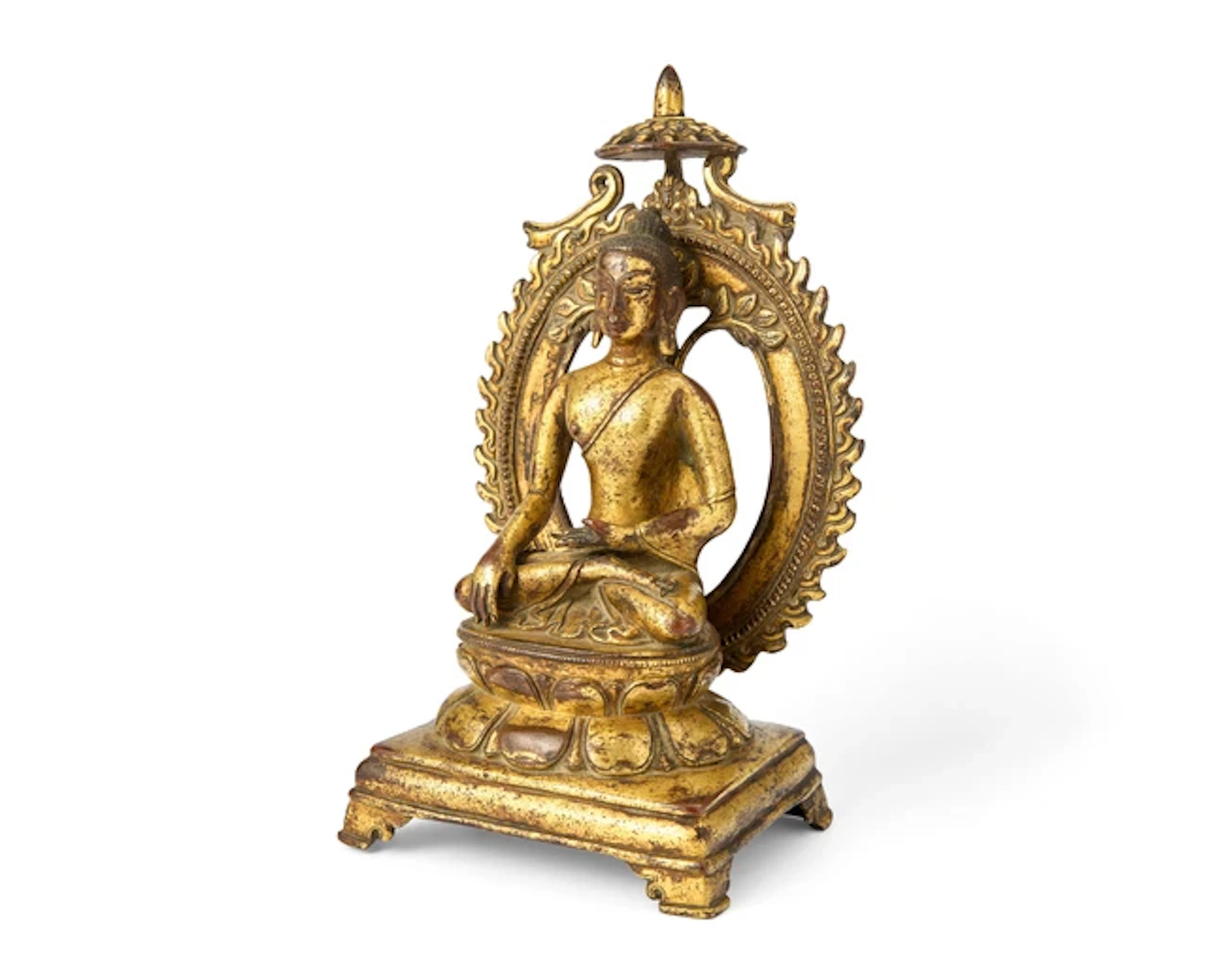 A Tibetan gilt copper alloy figure of Sakyamuni Buddha...