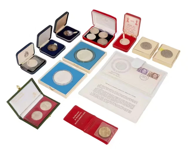 A group of silver and other coins
