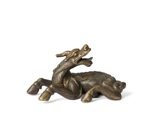 A Chinese bronze qilin scroll weight Qing dynasty