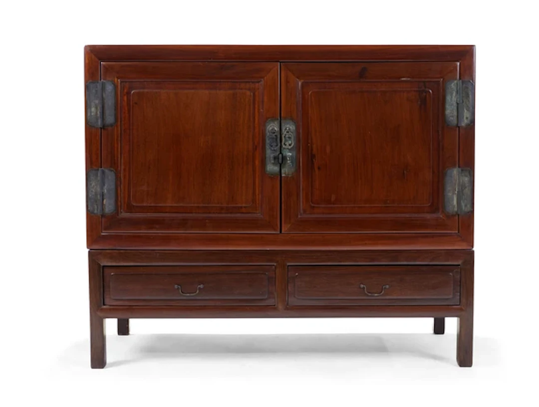 A Chinese hardwood low cabinet and stand 20th century The...