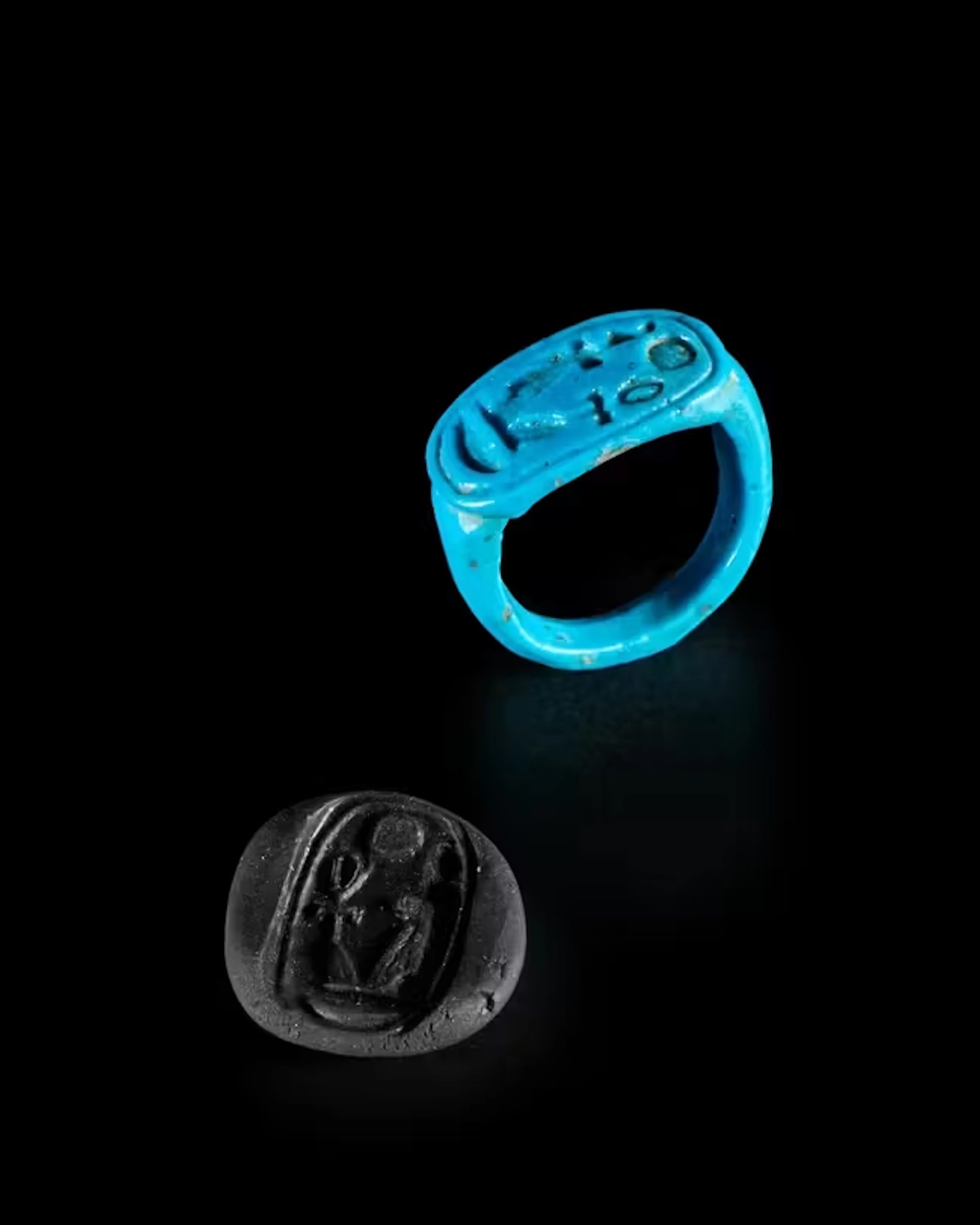 An Egyptian bright blue glazed faience finger ring with...