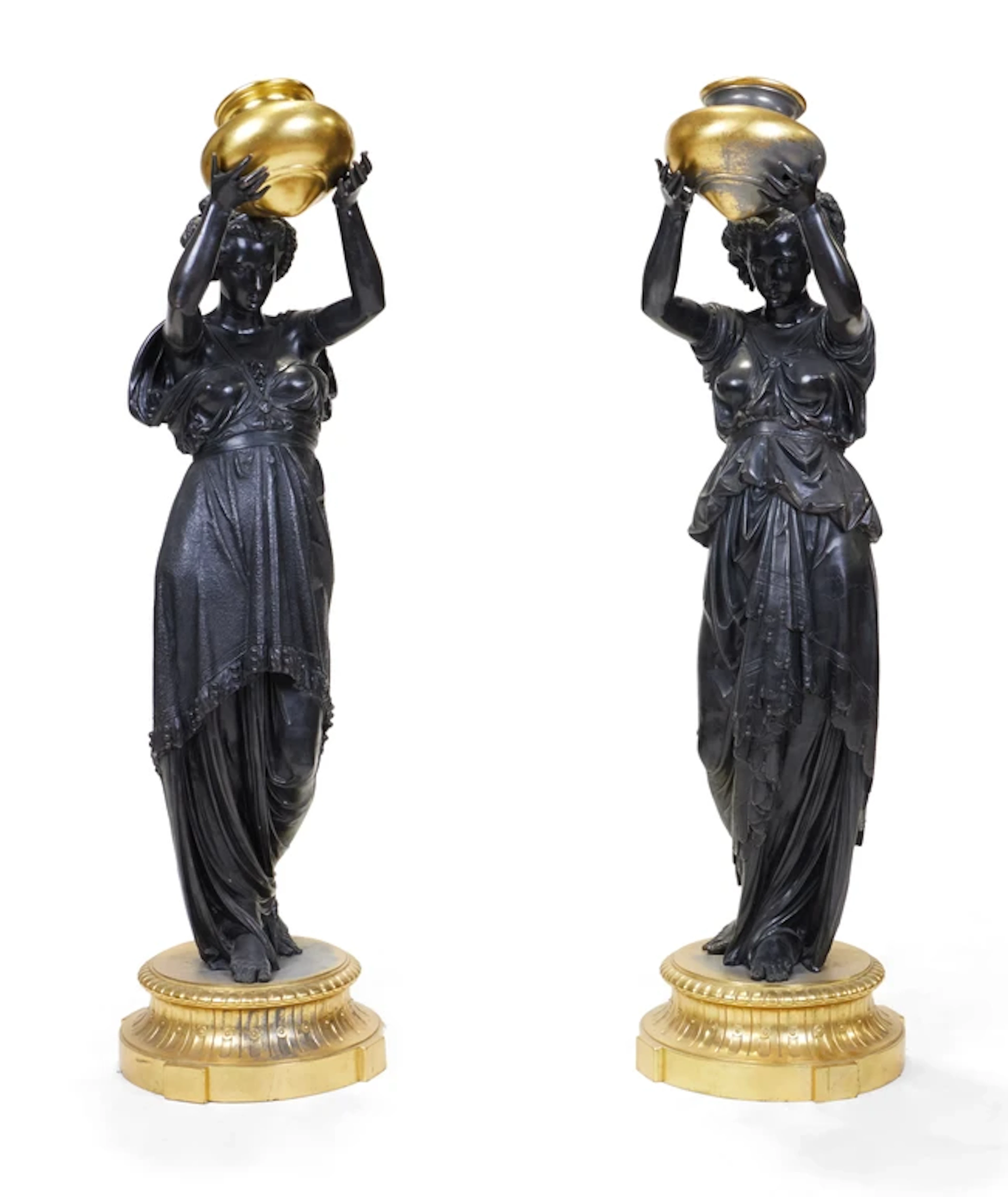 A pair of modern gilt and patinated metal standing maidens