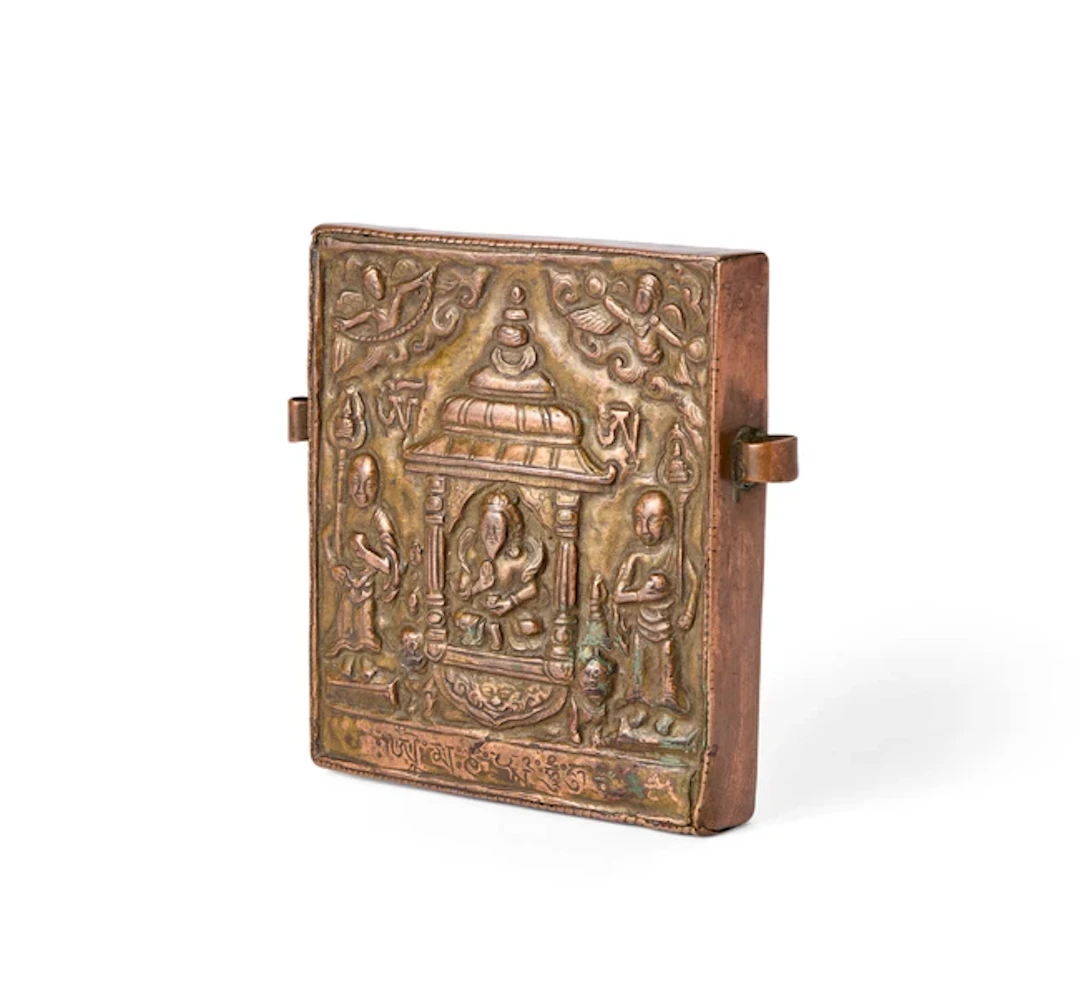 A Tibetan copper repoussé sealed container