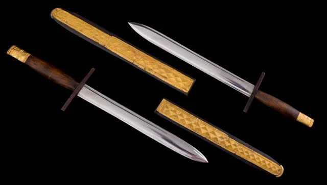 A pair of gold plaques from a scith and dagger