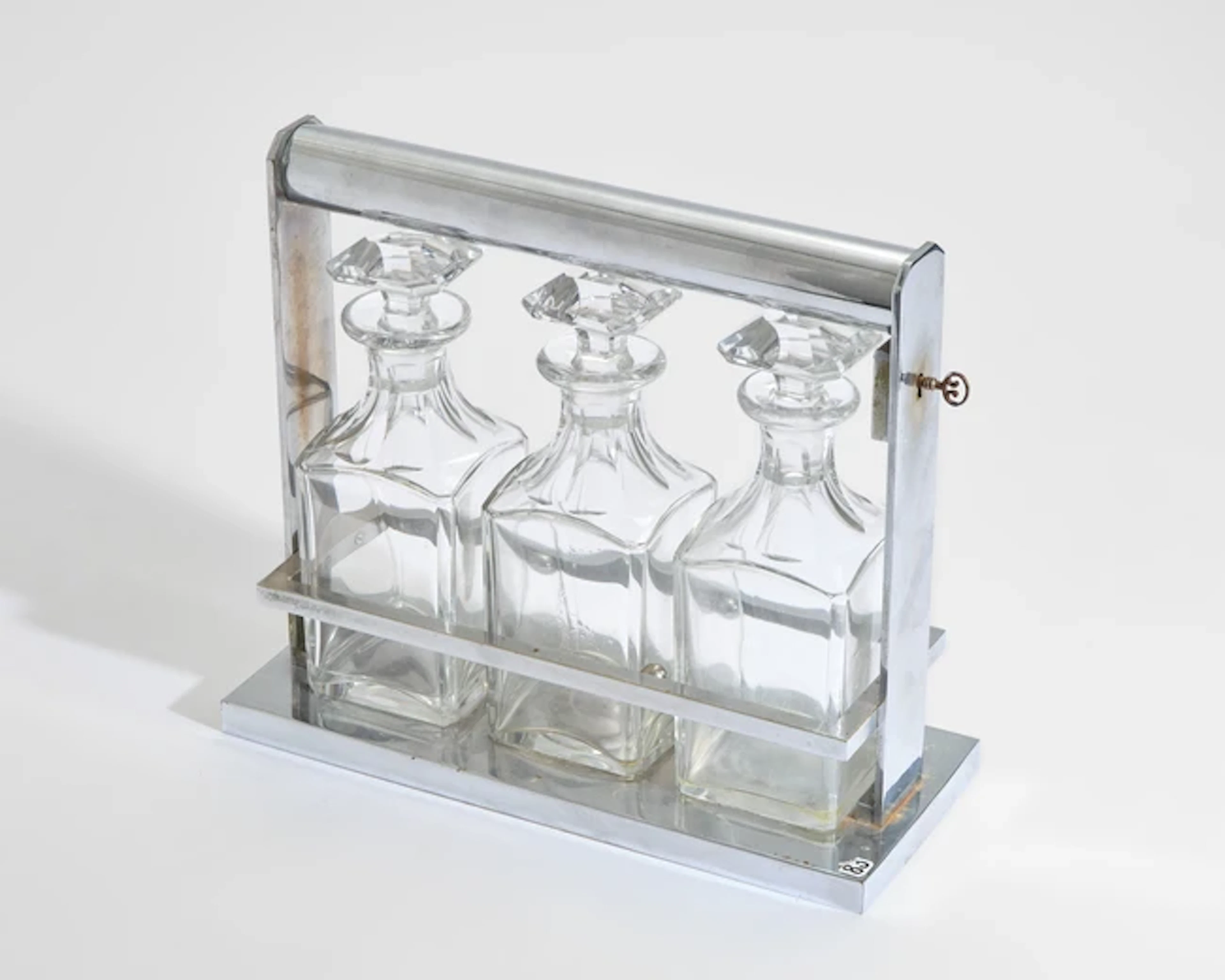 Jacques Adnet (1900-1984) Art Deco tantalus with three decanters