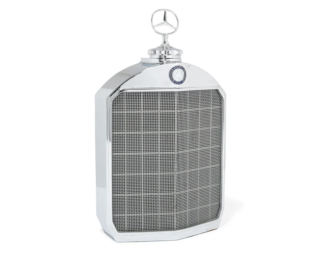 A Mercedes Benz chrome-plated decanter