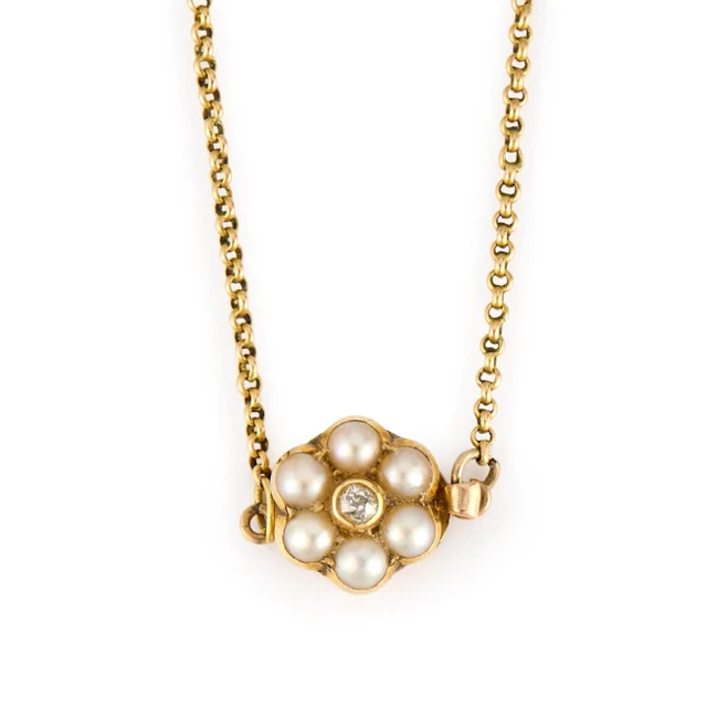 An early 19th century gold guard chain with half pearl cluster clasp