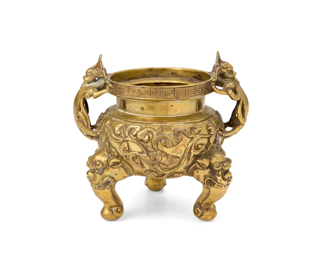 A Chinese copper-alloy 'lotus' tripod incense burner Qing dynasty