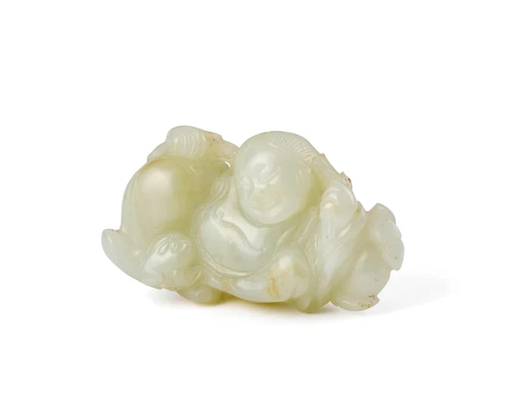 A Chinese pale celadon jade carving of Liu Hai and toad Qing dynasty