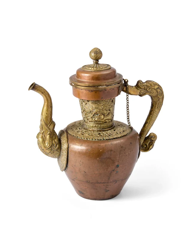 A Tibetan brass-mounted copper-alloy butter teapot...