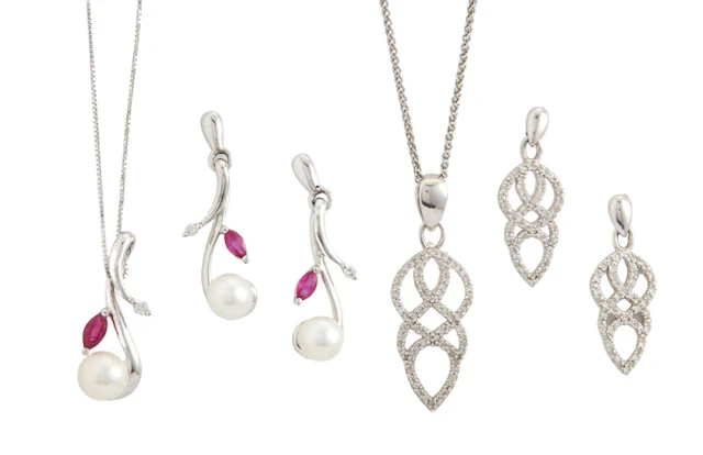 Two pendant necklace and earring sets