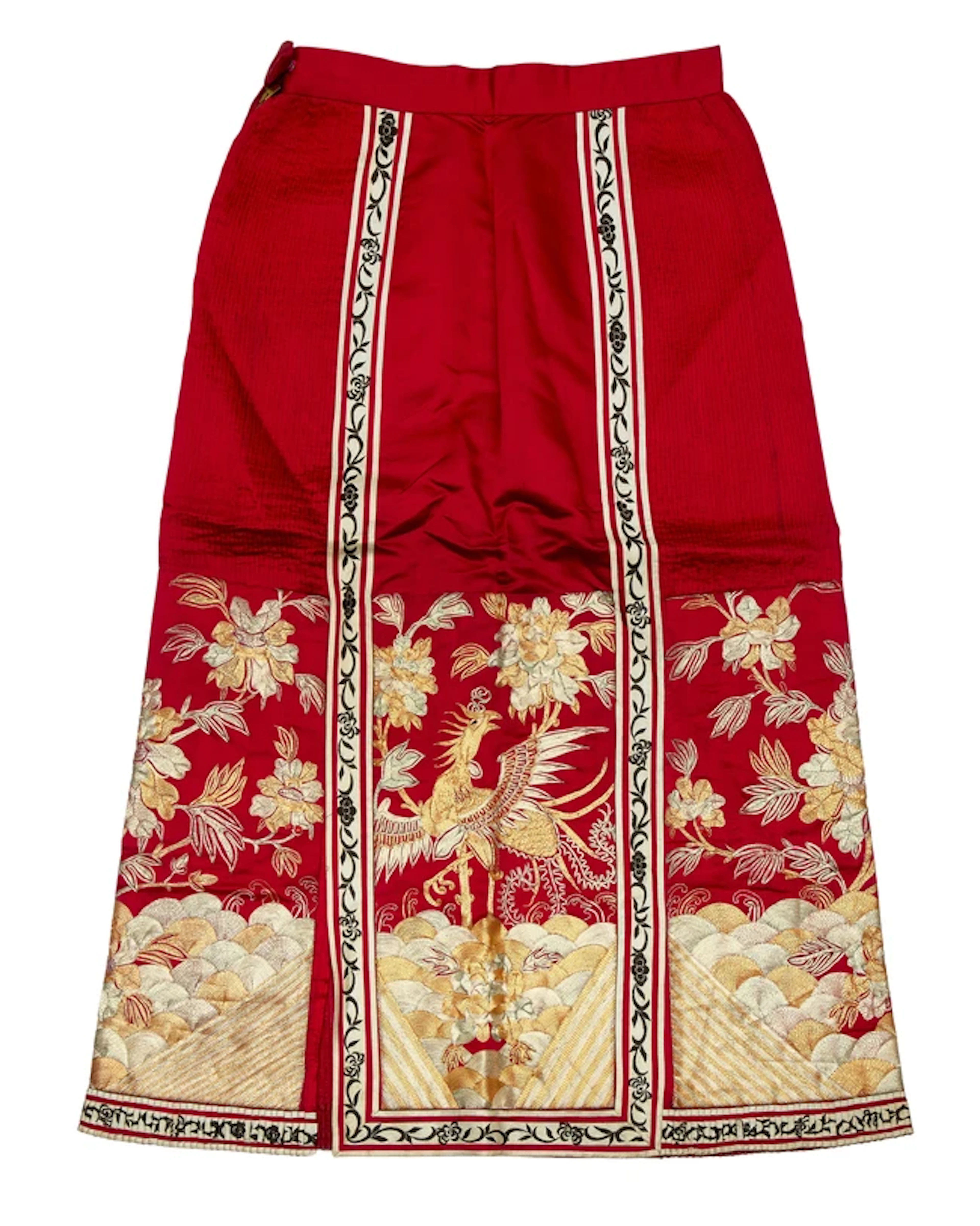 A Chinese couched thread-embroidered red silk skirt...