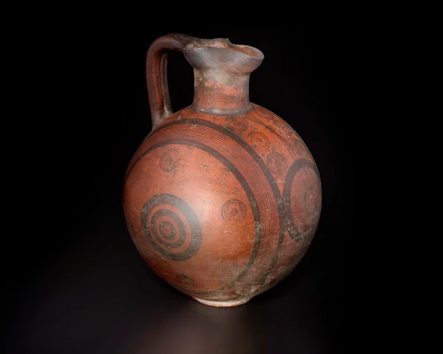 A large black-on-red bichrome ware pottery vessel