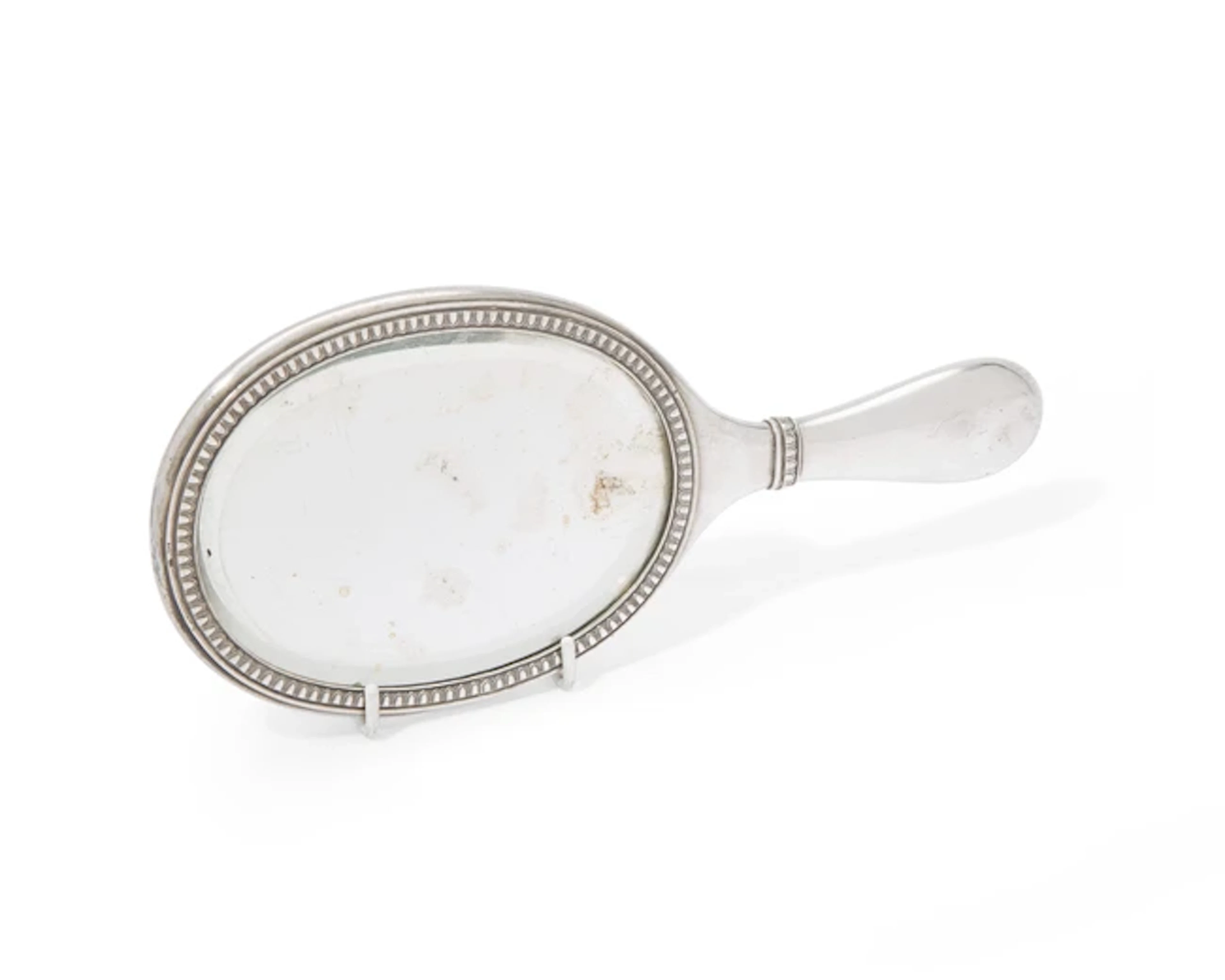 A Nicholas II Russian silver-mounted hand mirror