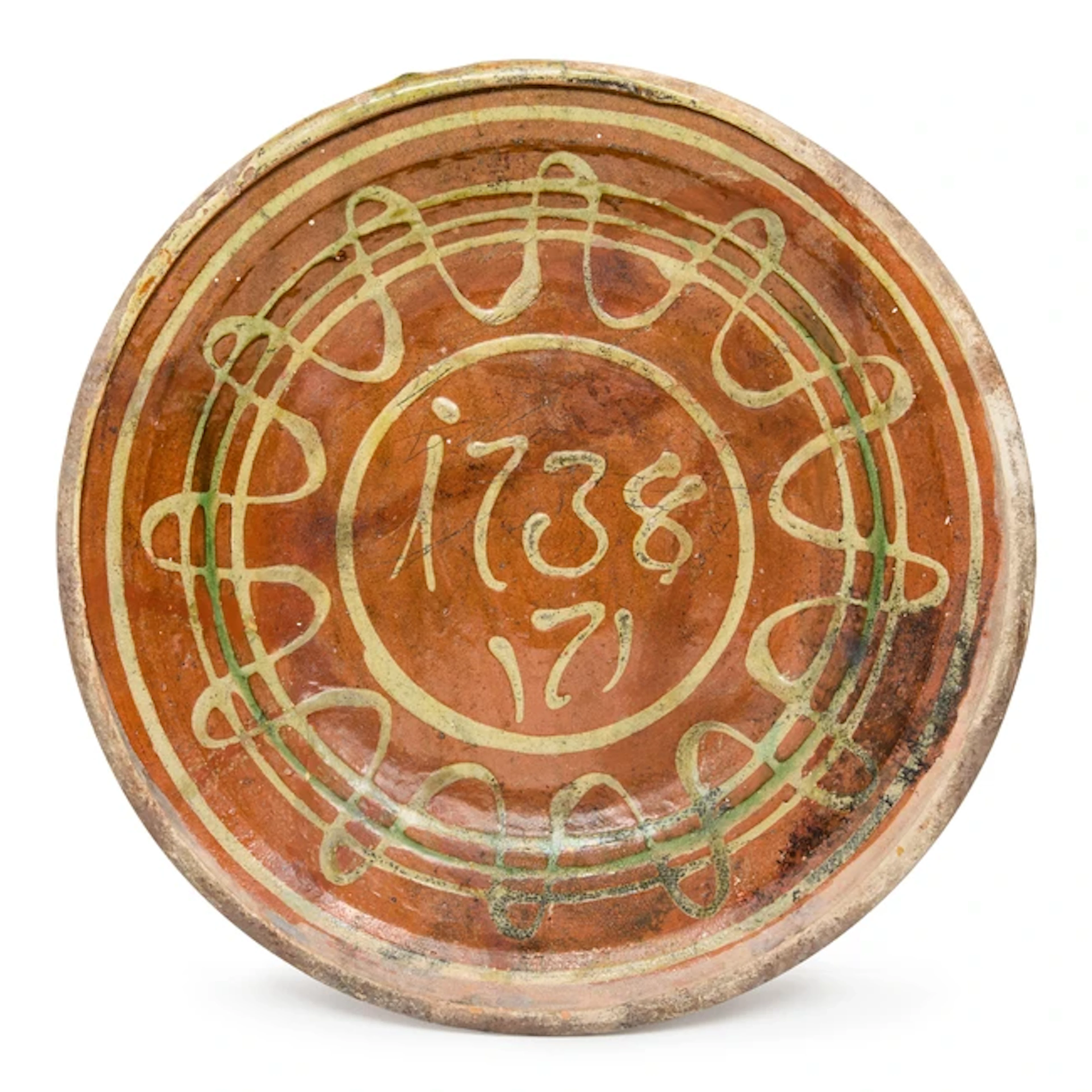 A lead-glazed and slip-decorated earthenware dish
