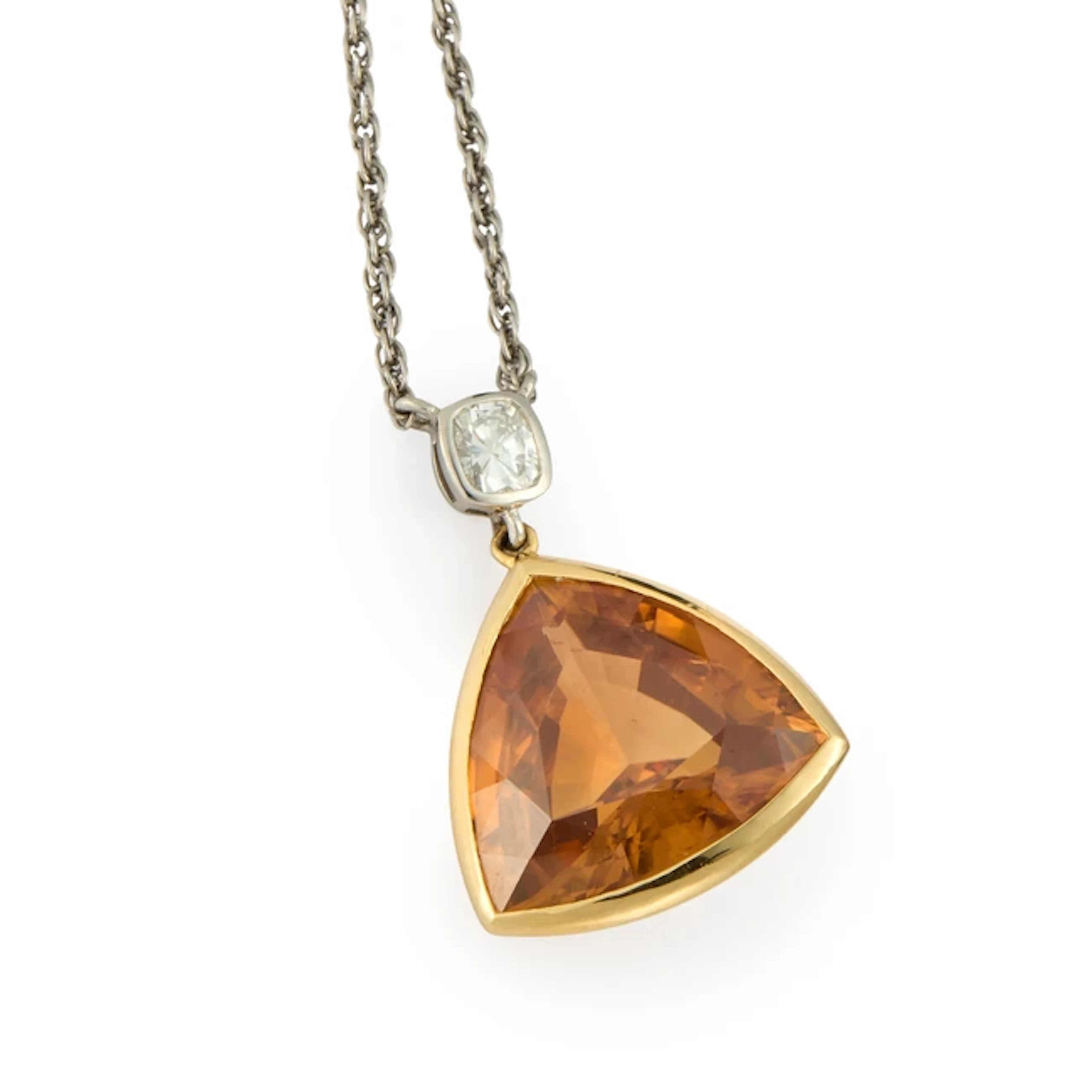 A zircon and diamond pendant necklace
