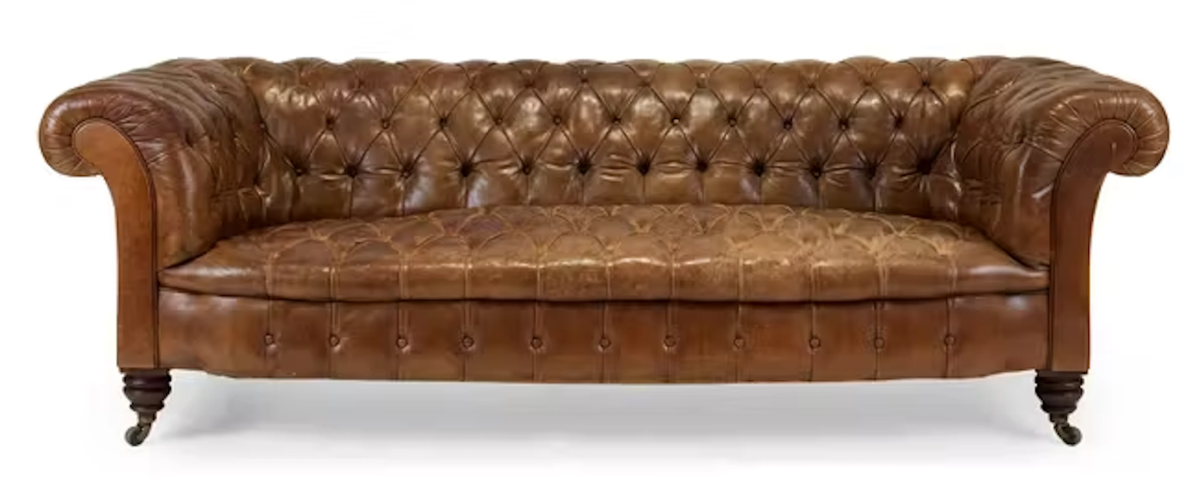 A Victorian tan leather chesterfield sofa