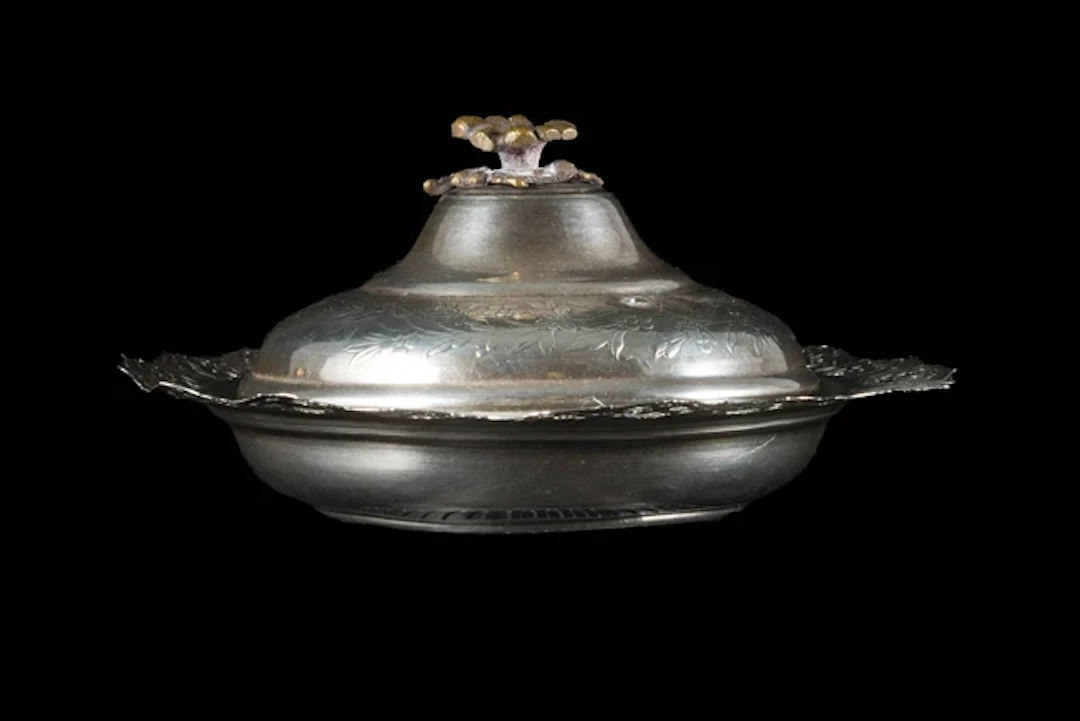 A composite small and shallow silver lidded dish