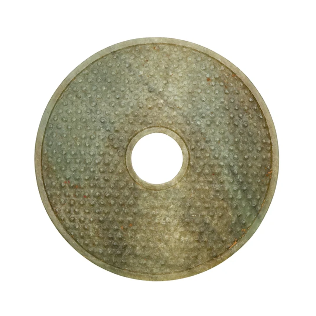 A Chinese pale green jade disc