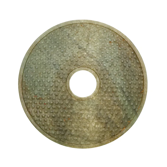 A Chinese pale green jade disc