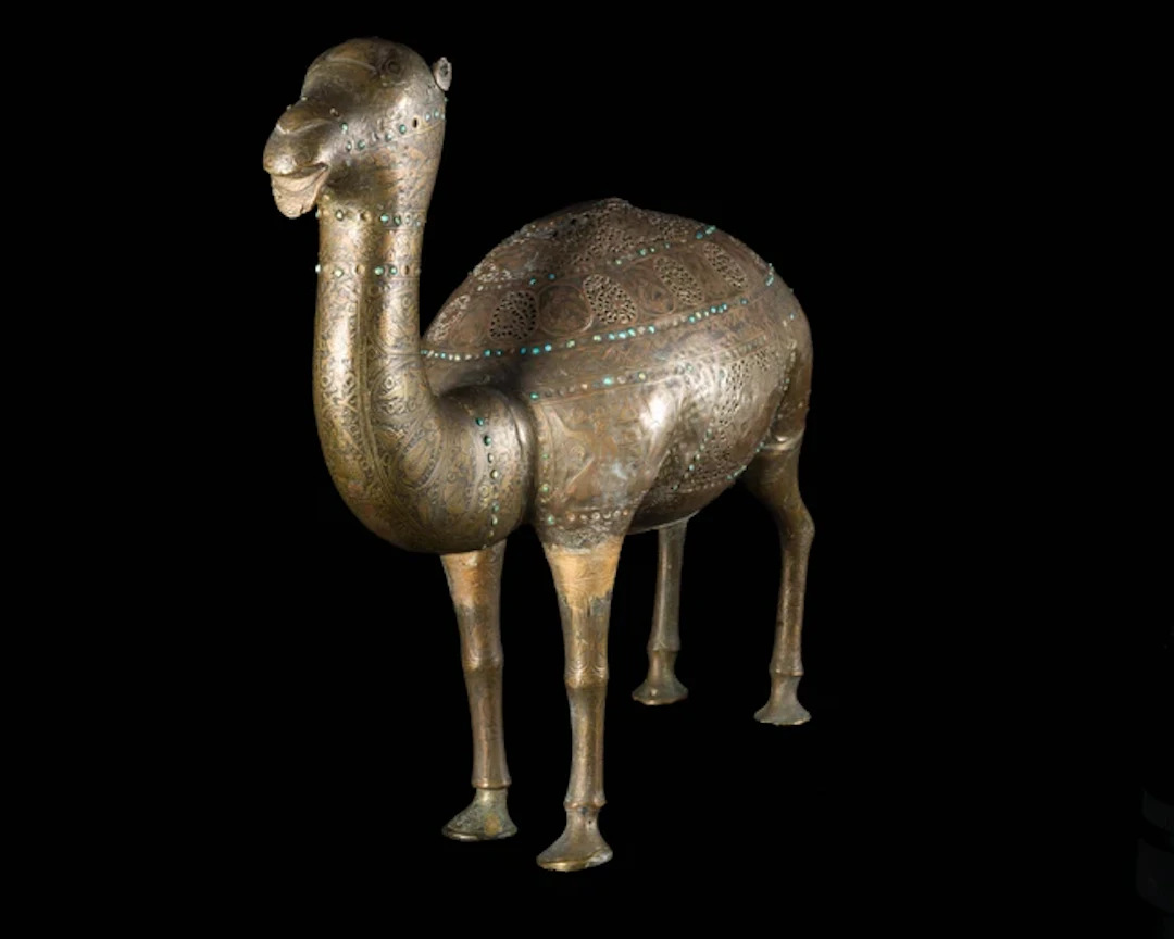 A Qajar openwork turquoise-inlaid camel