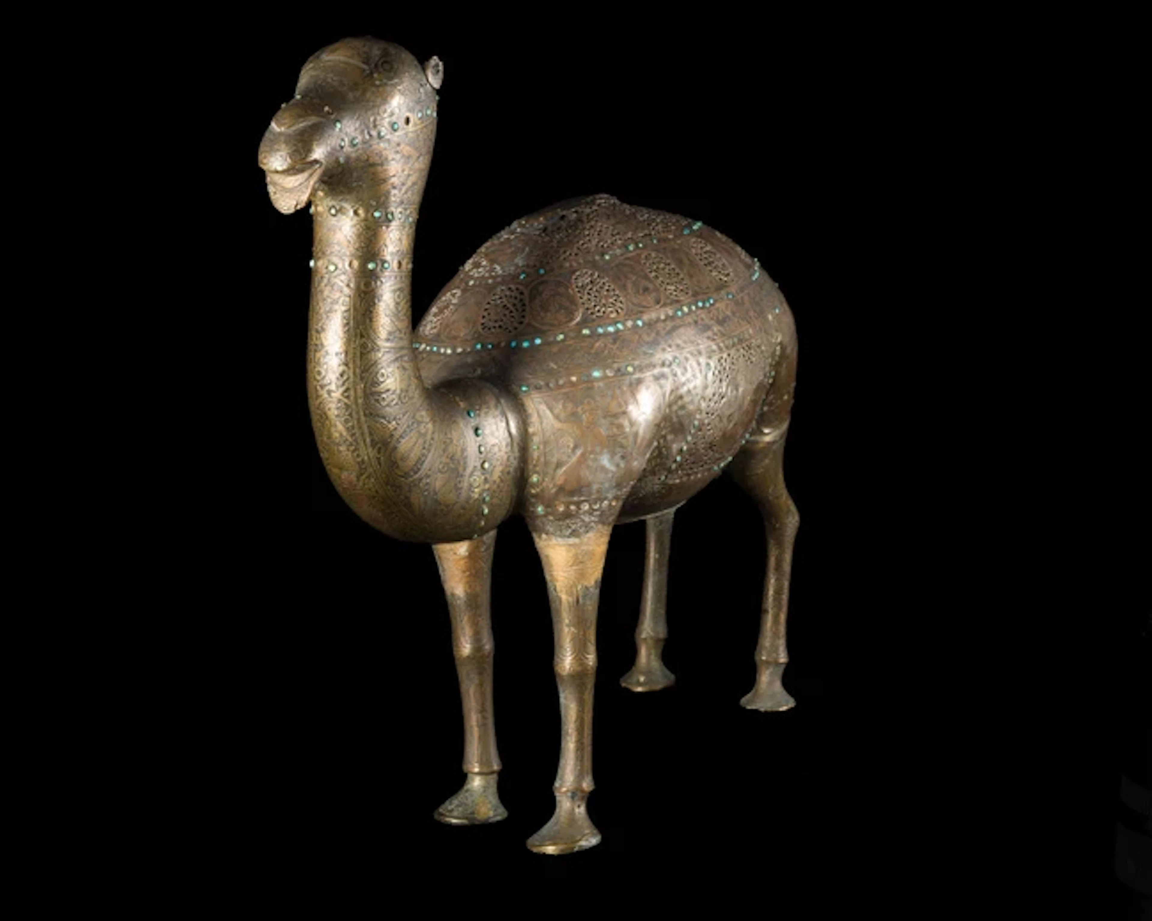A Qajar openwork turquoise-inlaid camel