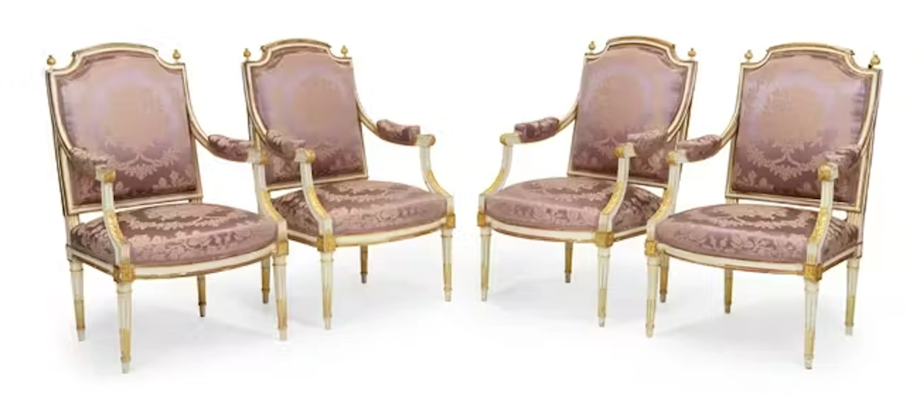 A set of four Louis XVI cream-painted and parcel-gilt fauteuils