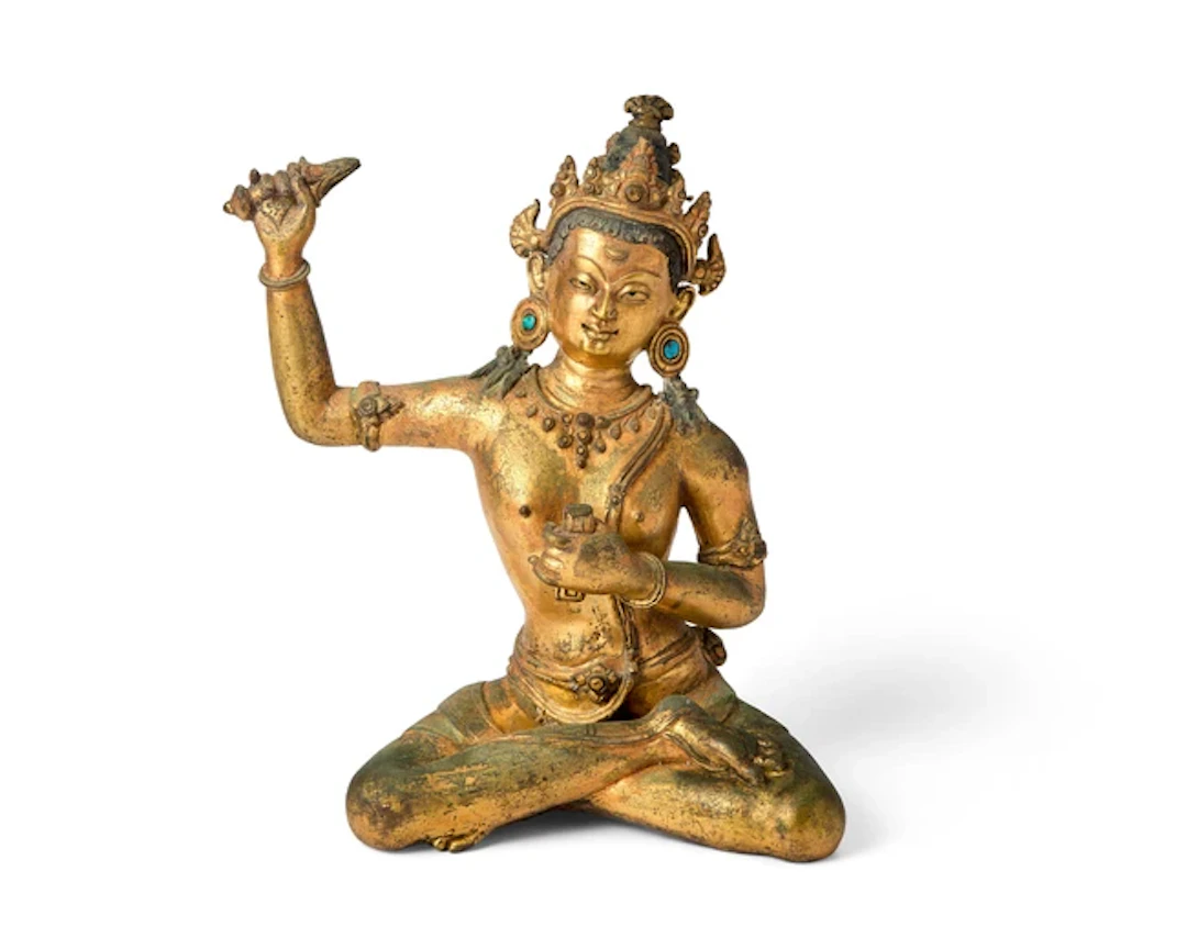 A Nepalese gilt-bronze figure of seated Bodhisattva...