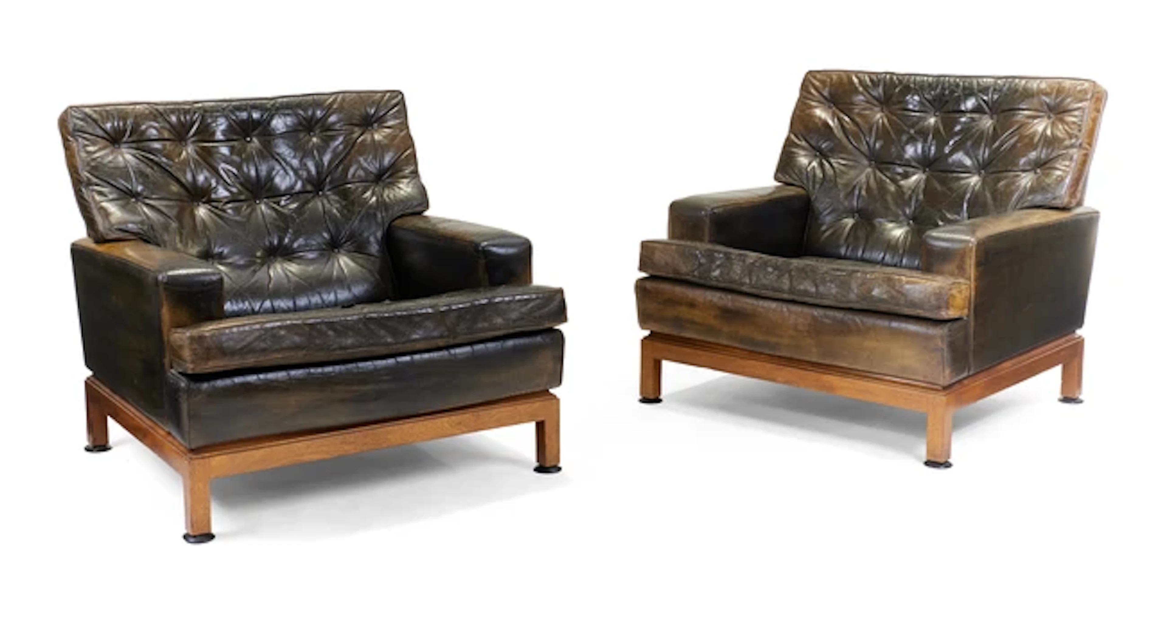 A pair of Scandinavian teak and faux leather armchairs