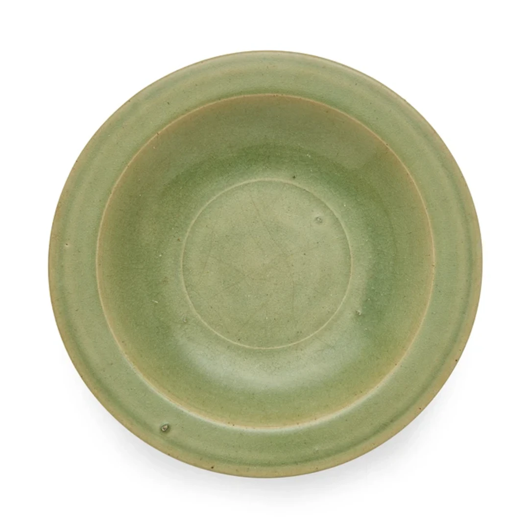 A large Chinese celadon plate Ming dynasty Rising from...