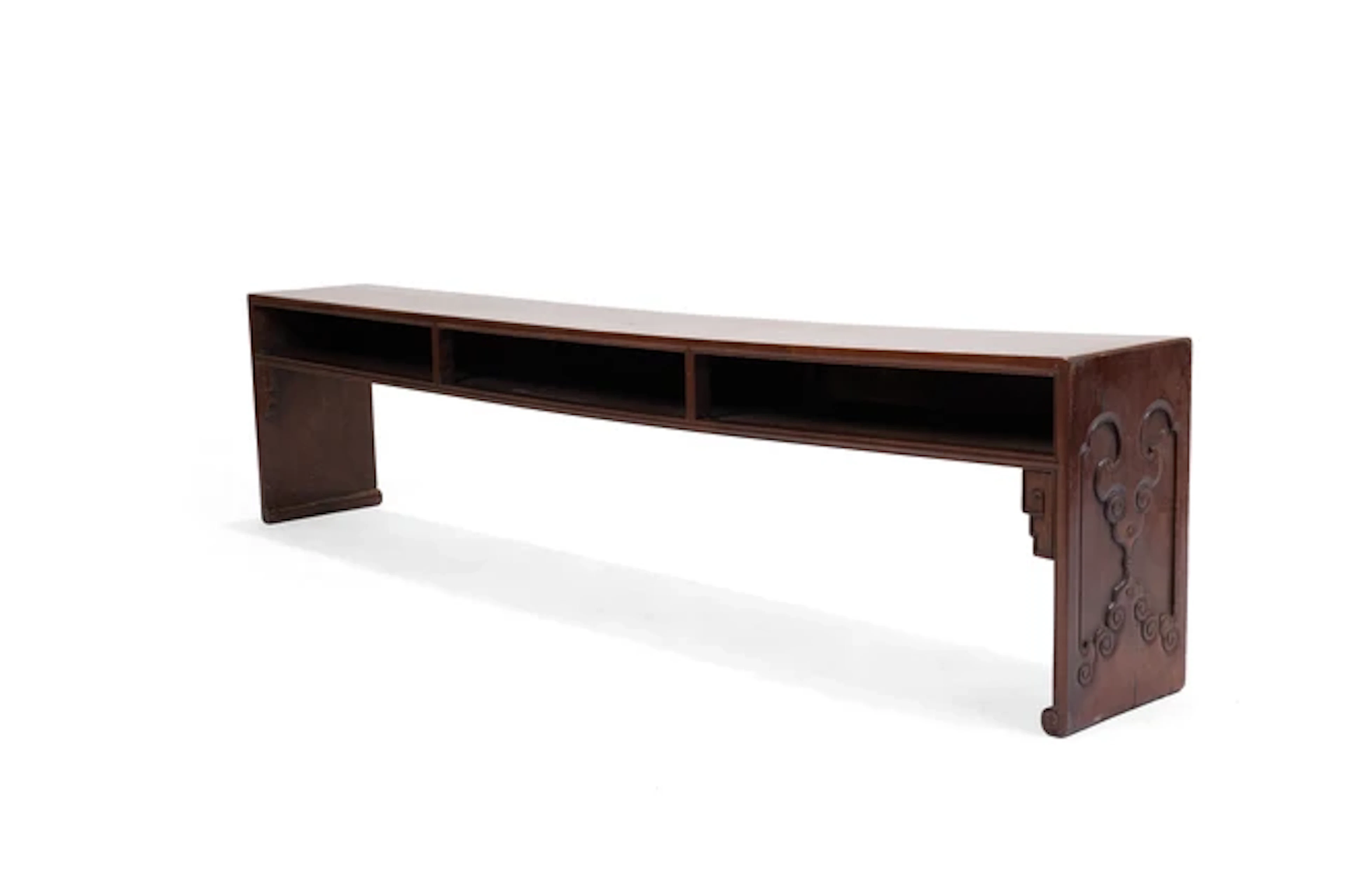 A Chinese hardwood long bench 20th century The...