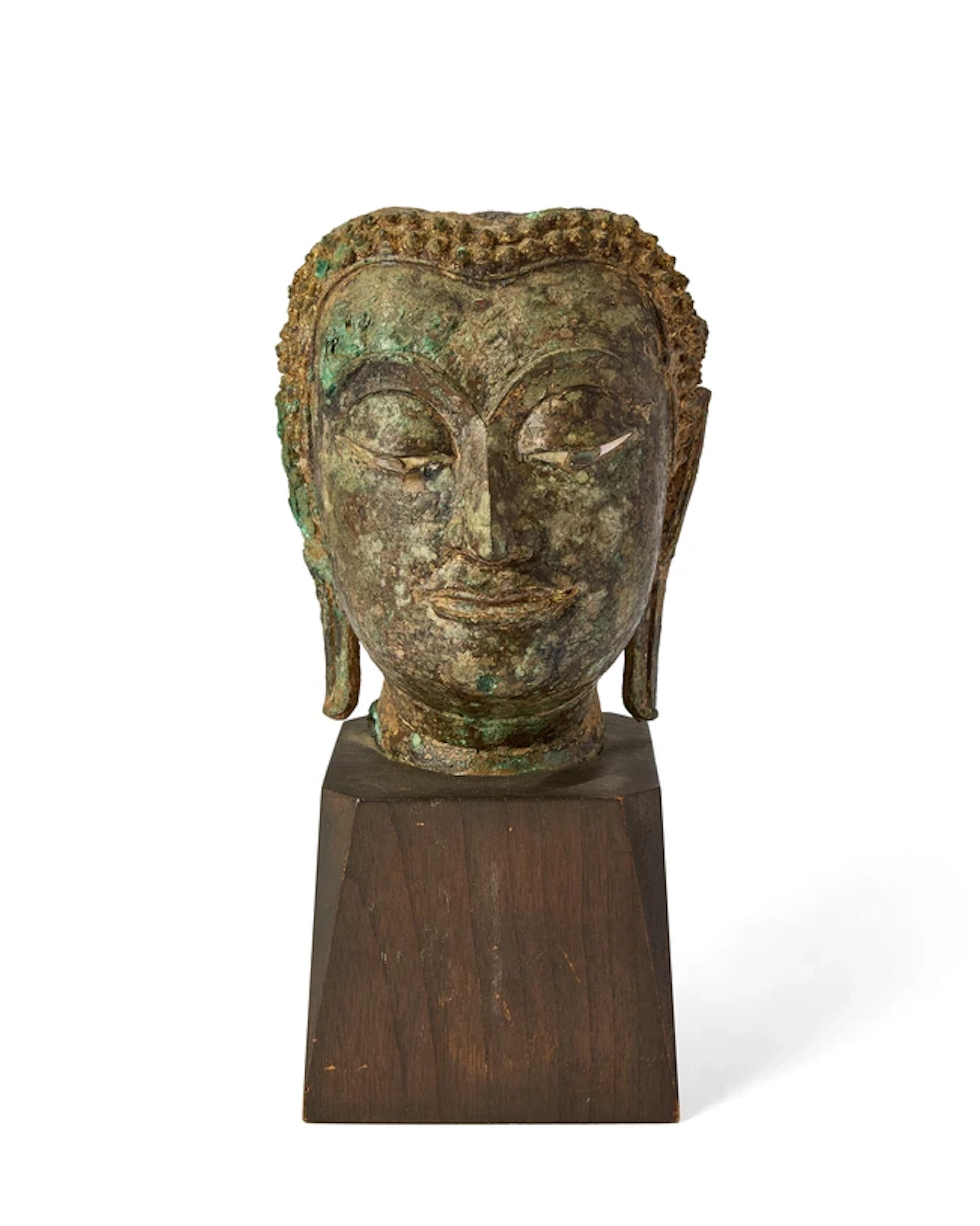 A fragment of a Sukhothai gilt bronze head of Buddha 15th...