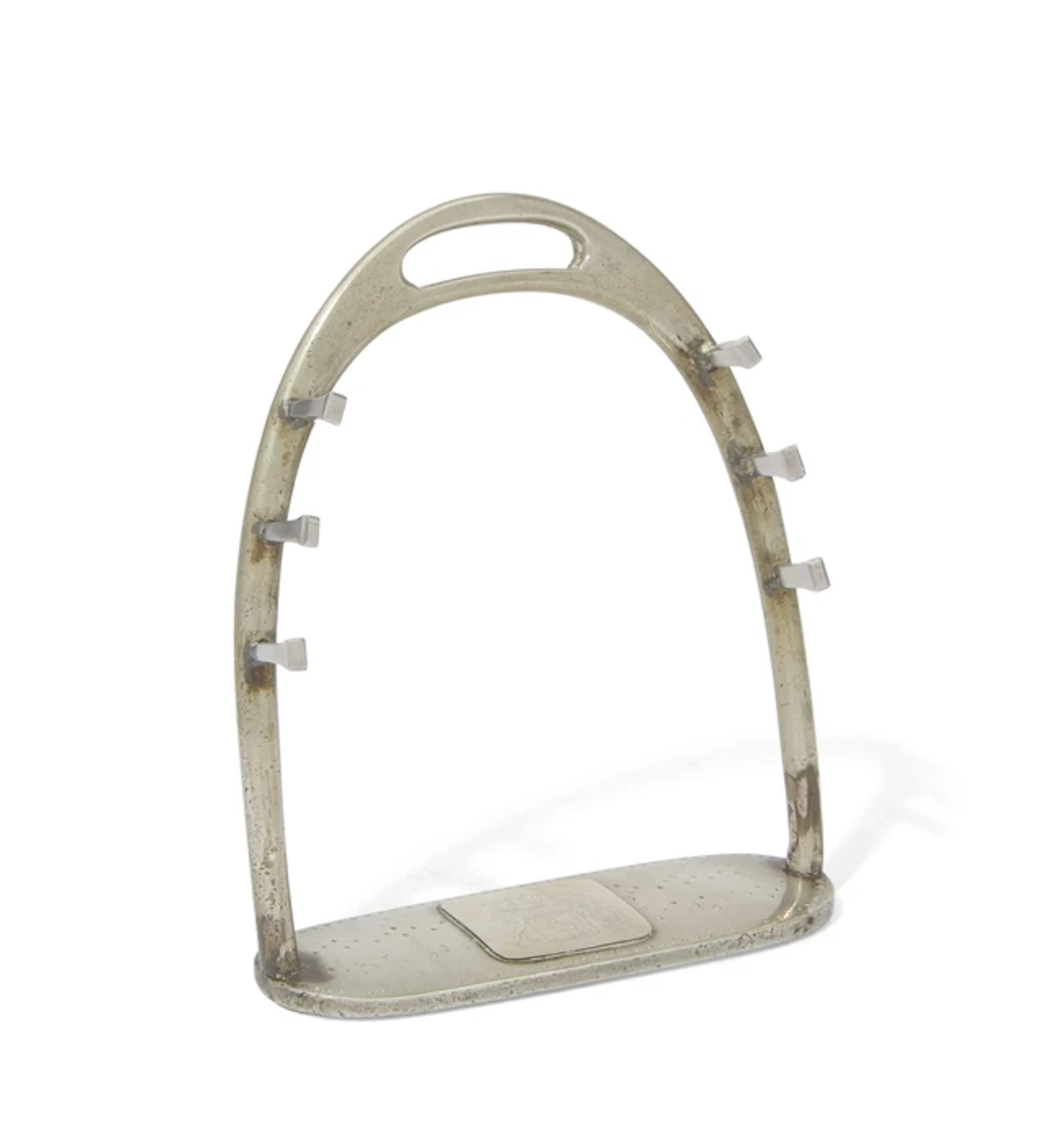 A novelty white brass pen holder in the form of a stirrup