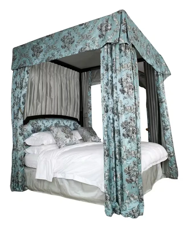 A modern ebonised four poster bed