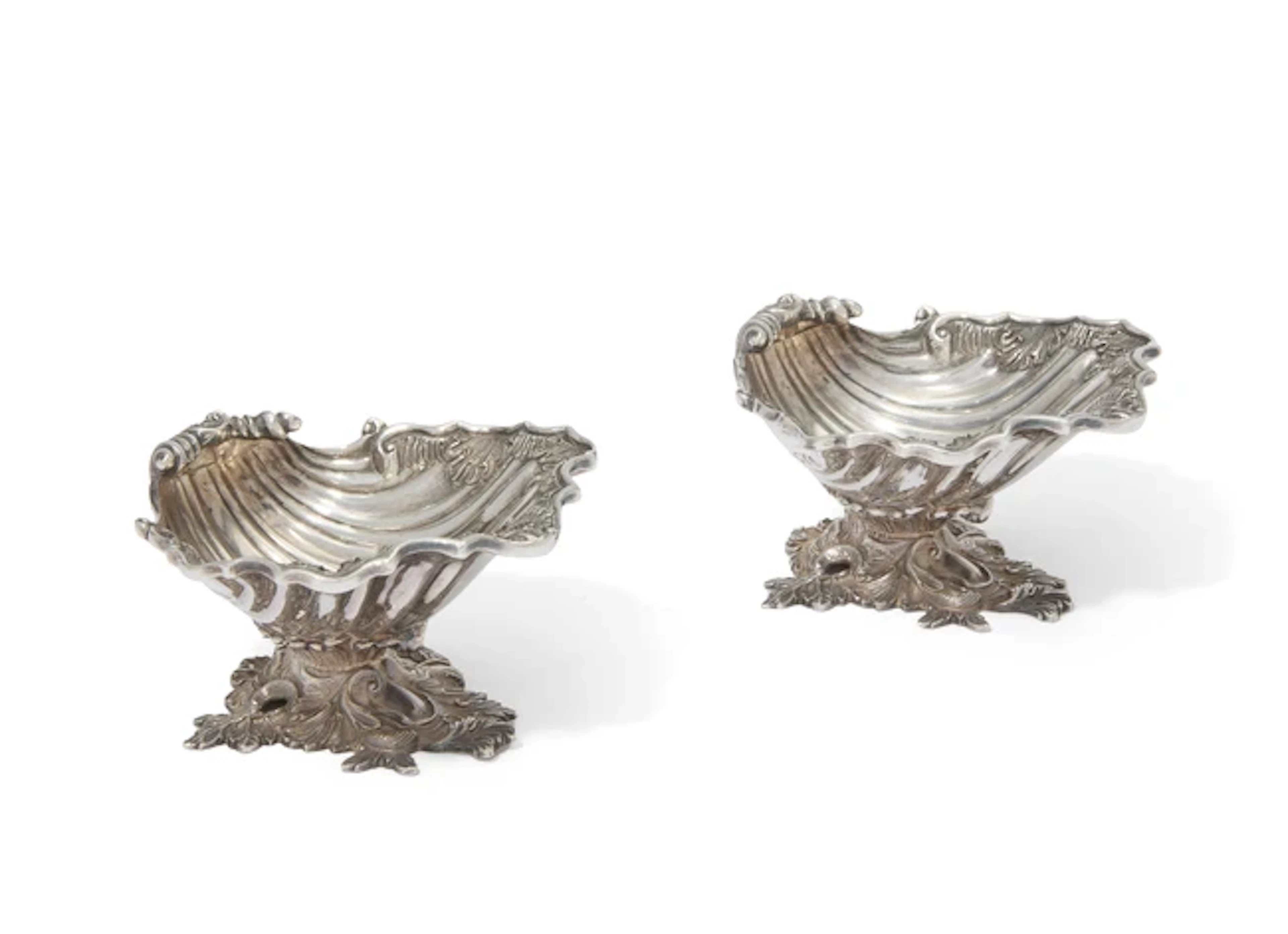A pair of Elizabeth II silver shell form salt cellars