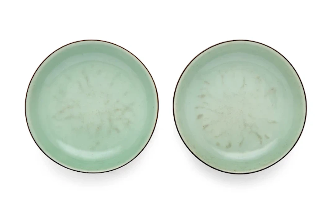 A pair of Chinese celadon glazed dishes Qing dynasty