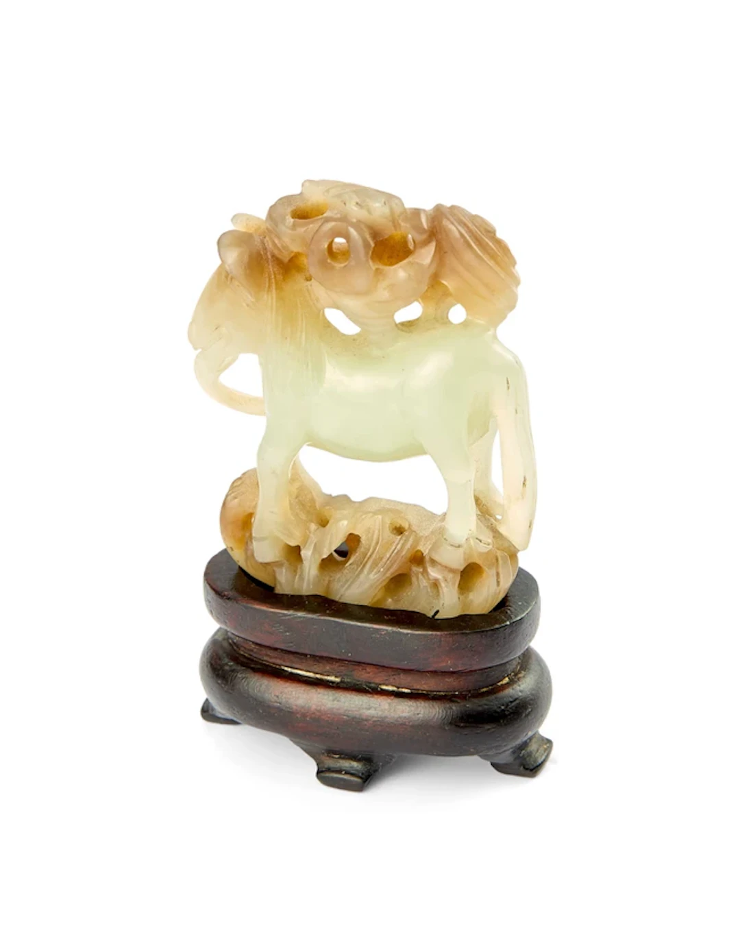 A Chinese reticulated celadon and russet jade carving of a horse Qing dynasty