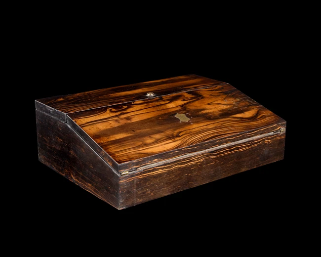 A Coromandel veneered brass inlaid writing slope