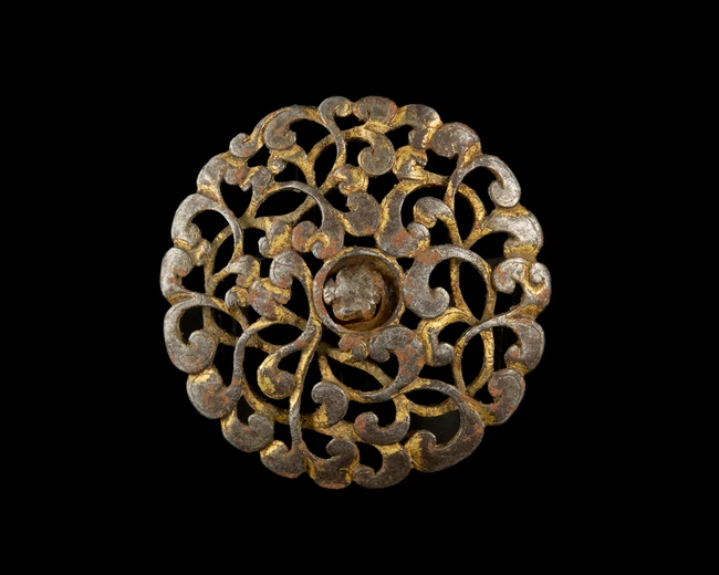 An openwork gilt steel shield bosse