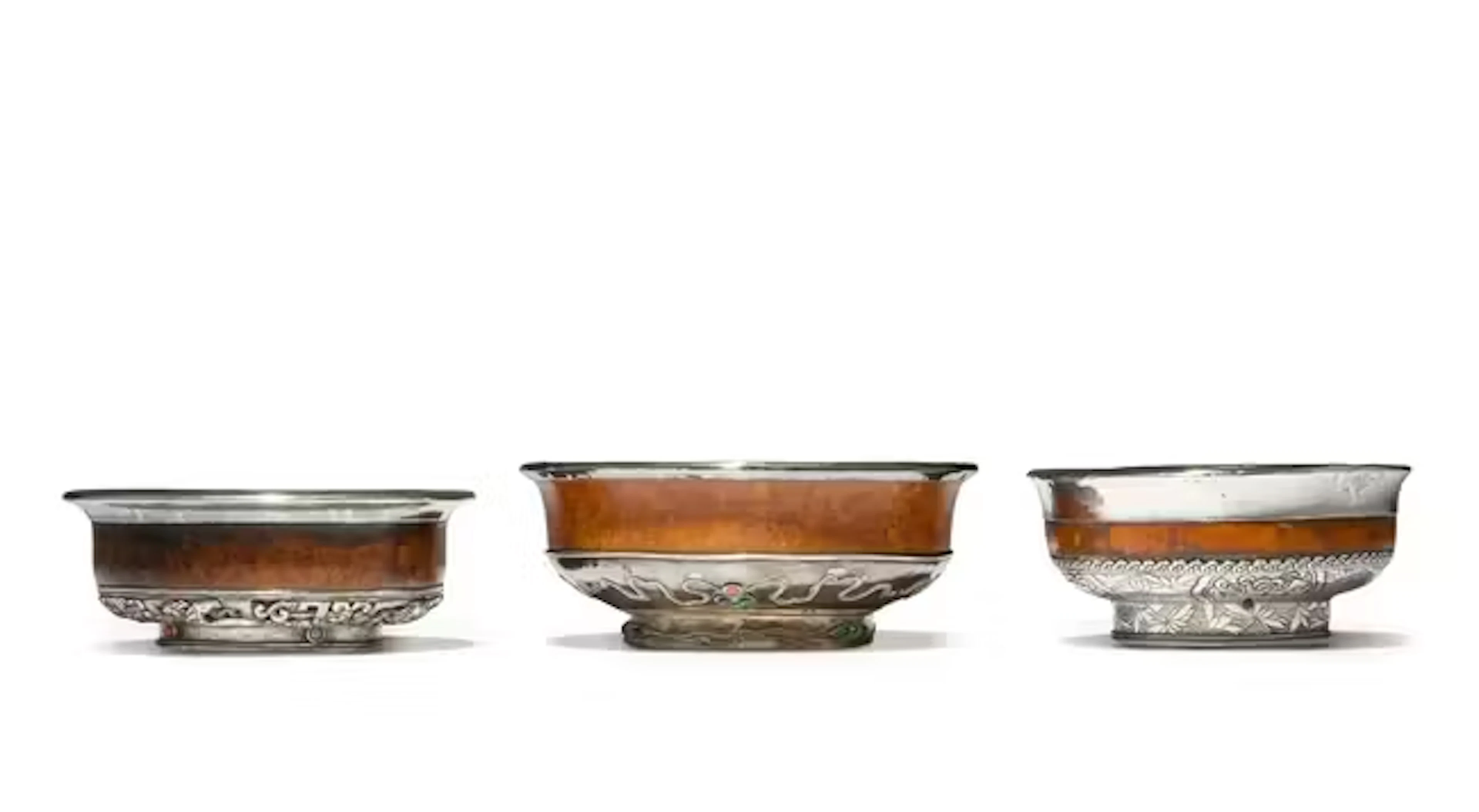 Three Tibetan silver-mounted burr wood bowls 19th/20th...