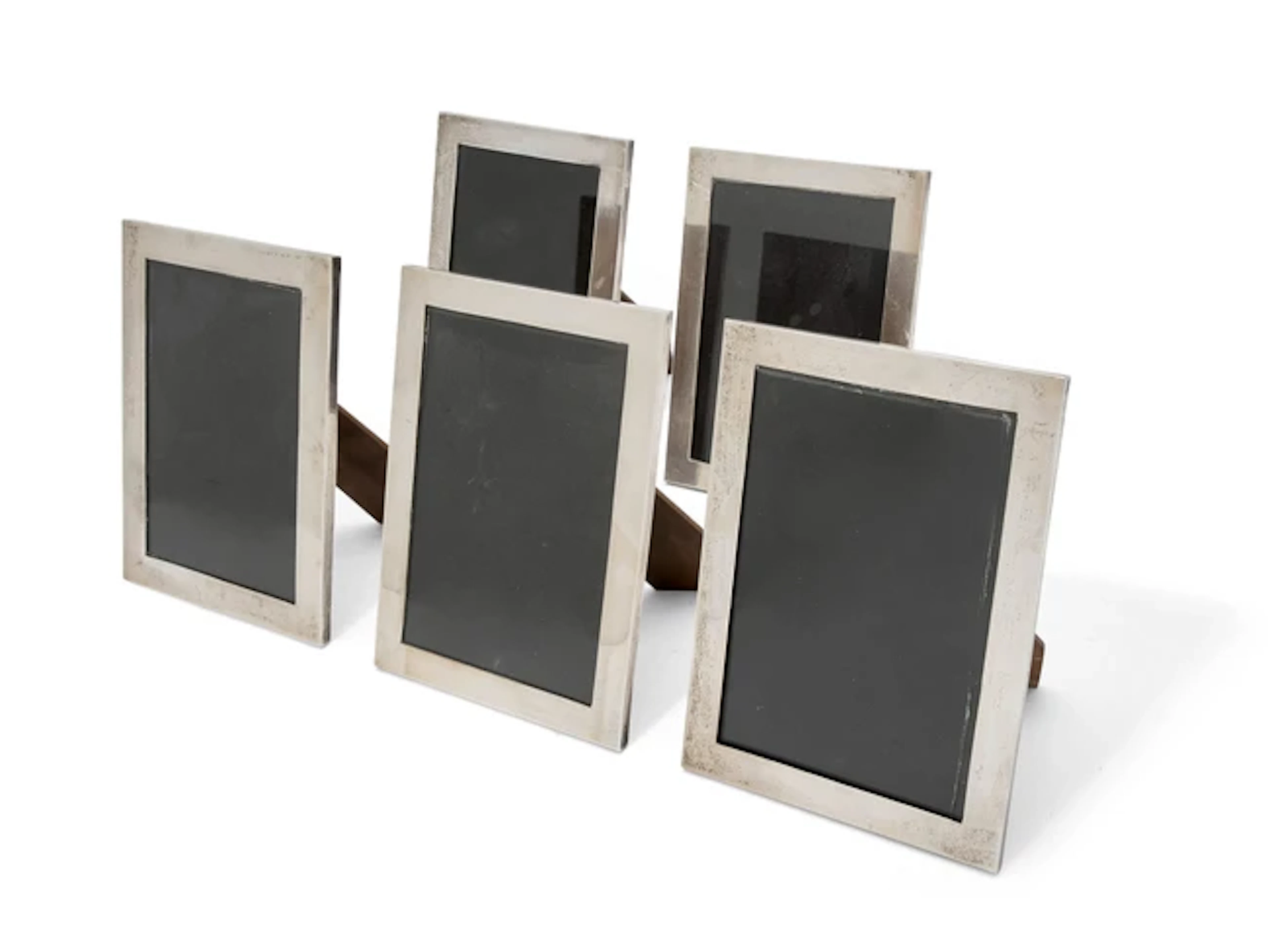 A group of five silver-mounted photo frames