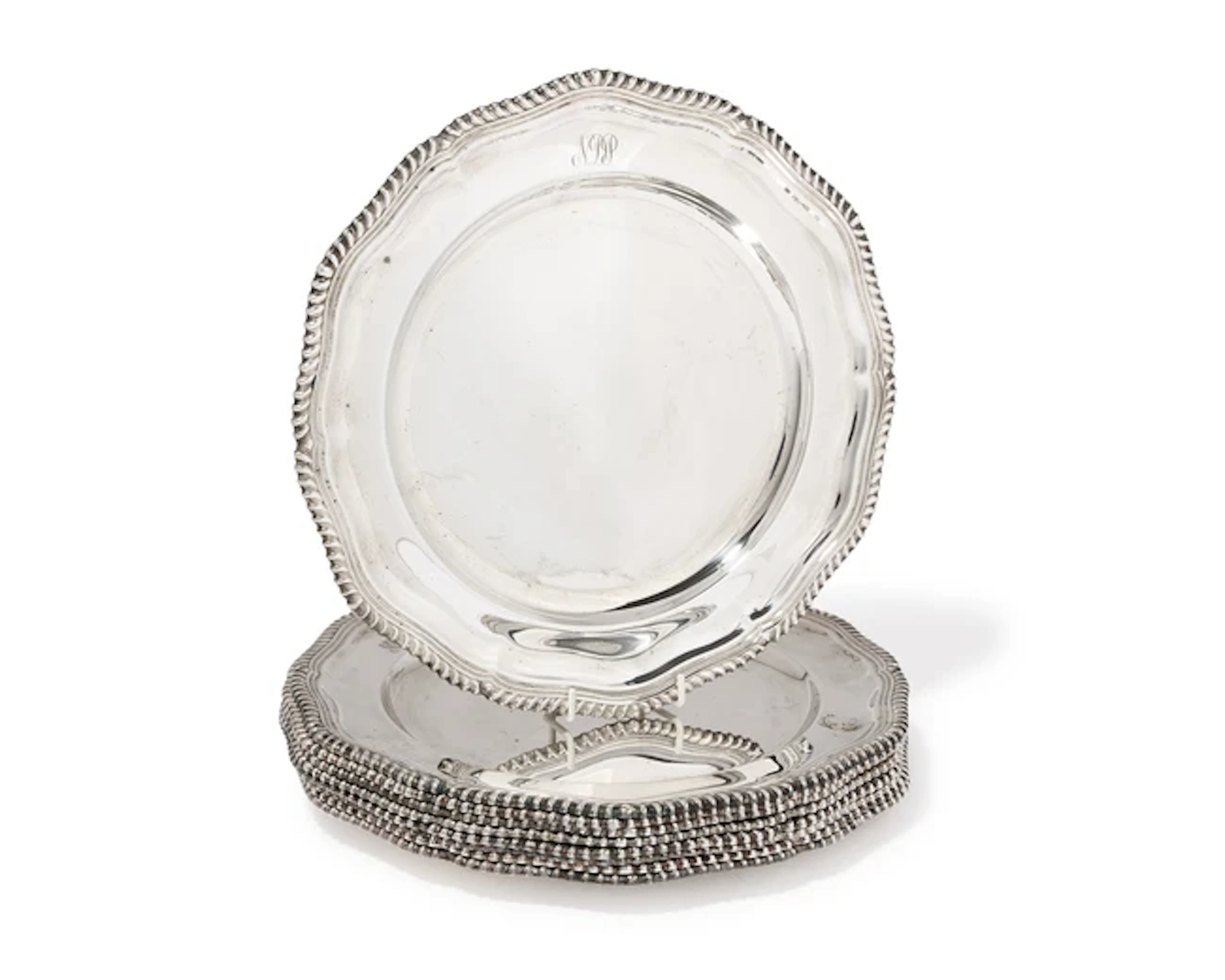A set of nine Elizabeth II silver dinner plates