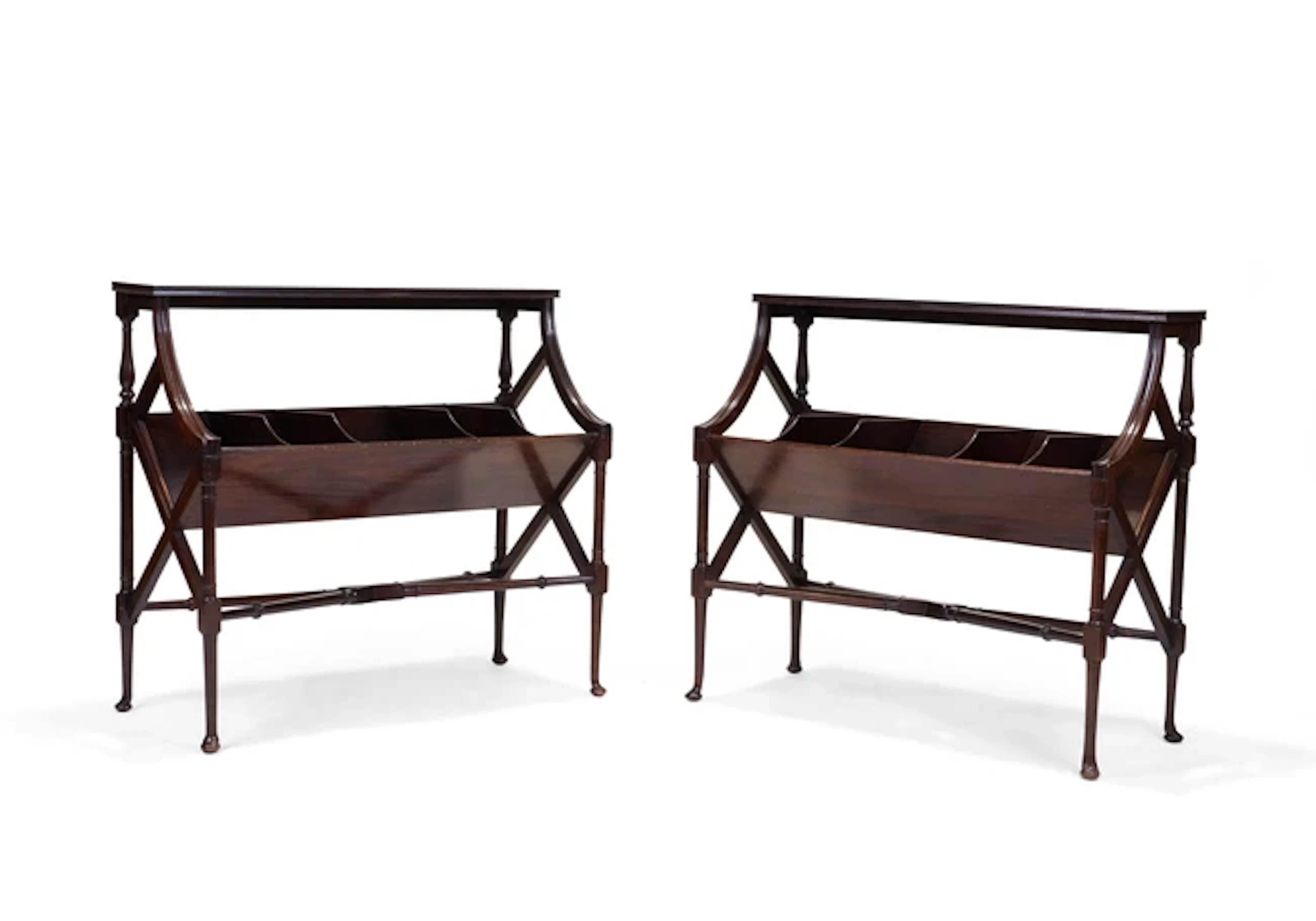 A pair of Edwardian mahogany book troughs